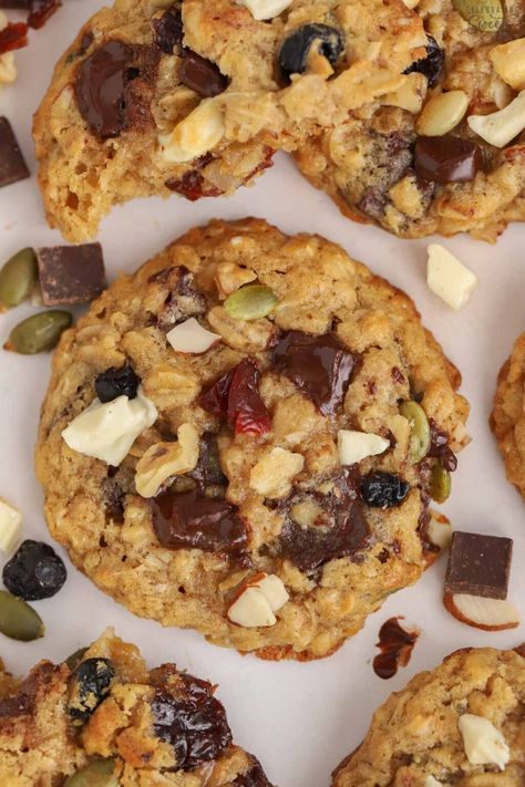 These soft and chewy Trail Mix Cookies are loaded with oats, nuts, seeds, dried fruit, and chocolate chips. Trail Mix Cookies Healthy, Cookies With Dried Fruit, Fruit And Nut Cookies, Dried Fruit Cookies Recipe, Dried Fruit And Nut Mix Recipes, Trail Mix Cookies Recipe, Granola Cookies Recipe, Dried Fruit Cookies, Snack Diet