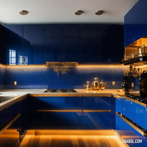 Kitchen with blue cabinets and a wooden floor and a stove top oven and microwave oven. Colors, Royal azure. Beautiful interior design. Follow us and visit our site for more amazing content! #decor #interiordesign #style #ideas #kitchen #homedecor #amazing #texture #blue #furniture #lighting #sketchbook #bathroom #rustic #livingroom Royal Blue And Gold Kitchen Ideas, Royal Blue And Gold Kitchen, Royal Blue Kitchen Cabinets, Gold Tiles Kitchen, Blue And Gold Kitchen, Blue Kitchen Accents, Saudi House, Royal Blue Kitchen, Kitchen With Blue Cabinets