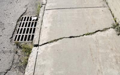 Settlement crack with stress line Cracked Sidewalk, Sidewalk Repair, Pedestrian Walk, Types Of Concrete, Accidents Happen, Slip And Fall, City Aesthetic, Manado, Walkway