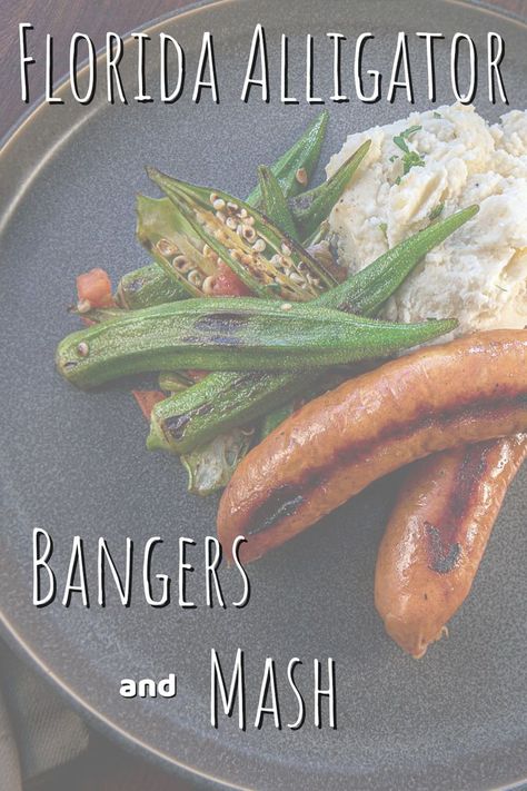 A plate with two Florida alligator sausages served over mashed potatoes with blackened okra and silverware set on a linen napkin beside it. Alligator Sausage, Bangers And Mash, Florida Food, Florida Girl, Sausage Recipes, Okra, Have You Ever, Green Beans, Alligator