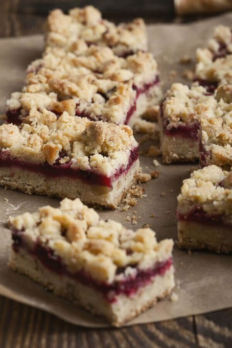 Easy Cake Mix Raspberry Bars - Made with yellow cake mix, quick-cooking oats, butter, raspberry jam, water | CDKitchen.com Blackberry Shortbread, Raspberry Oatmeal Bars, Cake Mix Bars, Cake Mix Cookie Bars, Recipes Using Cake Mix, Easy Bar Recipes, Easy Bar, Raspberry Bars, Super Easy Desserts