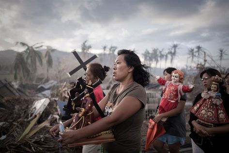 Survivors of Super Typhoon Haiyan, which left 1.9 million homeless, take part in a religious procession in Tolosa on the eastern Philippine island of Leyte. News Logo, Uk Visa, World Press, Leyte, Picture Editor, Photo Awards, Discovery Channel, Phnom Penh, Press Photo