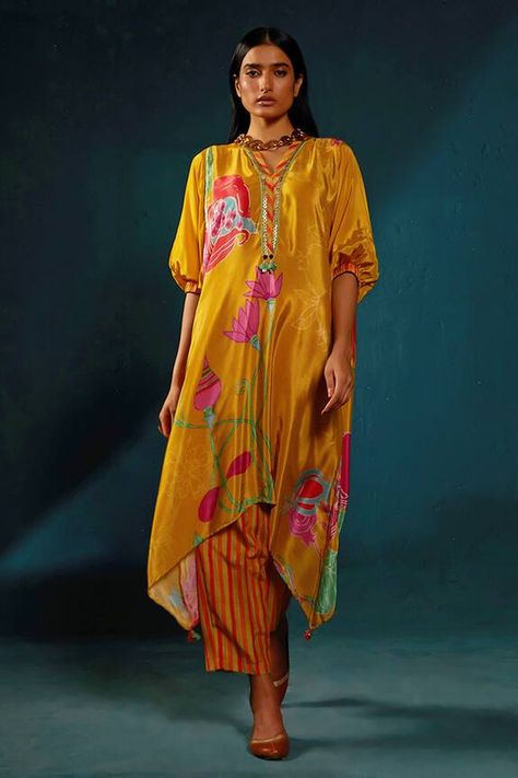 Yellow asymmetric kaftan kurta with floral print, sequin embroidered neckline. Paired with a striped pant. - Aza Fashions Printed Kaftan Designs, Printed Kurta Designs Women, Asymmetrical Kurti, Kaftan Patterns, Kaftan Kurta, Kaftan Pattern, Basil Leaf, Guru Ji, Kaftan Designs