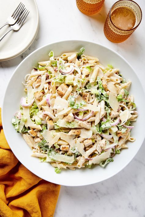 This chicken Caesar Pasta salad is a combination dish ideal for the grilling season. A creamy, delicious Caesar dressing pulls all the elements together, marrying red onion, romaine lettuce, and penne pasta. Succulent chicken adds heartiness and protein, and bacon gives a richening final touch. This is the perfect dish to enjoy all summer long. Ceased Chicken Pasta Salad, Chicken Pasta Ceaser Salad, Pasta Chicken Ceasar Salad Recipe, Viral Chicken Caesar Pasta Salad, Ceaser Pasta Salad With Grilled Chicken, Summer Side Dishes Recipes, Easy Macaroni Salad, Chicken Caesar Pasta Salad, Homemade Baked Beans