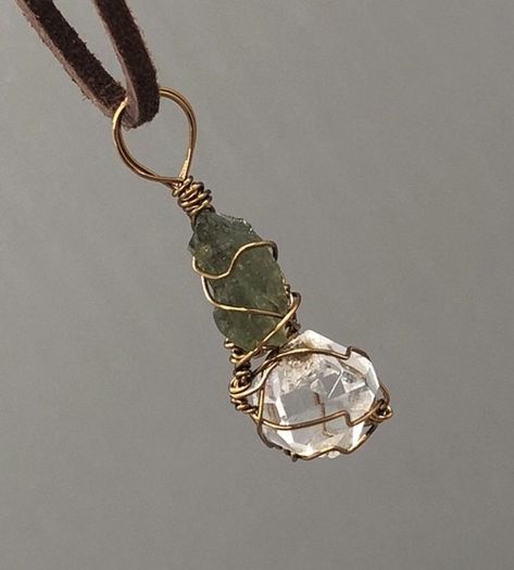 Handmade, wire wrapped moldavite and Herkimer diamond necklace. Moldavite is a rare tektite that is only found in the Czech Republic. Formed 14.8 million years ago as a result of a meteor collision with earth.  Herkimer diamonds are only mined from Herkimer county, NY. This crystal amplifies the energy of any stone it is paired with.  These two crystals put together create a POWERFUL energy! Be prepared for accelerated spiritual growth! Pebble Jewelry, Herkimer Diamond Necklace, Moldavite Jewelry, Feather Fan, Powerful Energy, Wire Wrapping Crystals, Handmade Wire Wrapped, Handmade Wire, Wrapped Jewelry