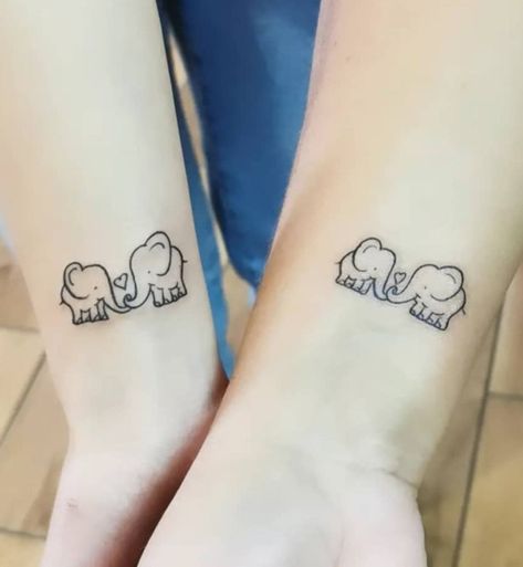 Simple Elephant Tattoos in Popular Styles for Inspiration | Inku Paw Elephant Tattoos Couple, Mother And Daughter Elephant Tattoo, Twin Elephant Tattoo, Two Elephants Tattoo Small, Mom Daughter Tattoos Elephant, Mother Daughter Frog Tattoos, Couple Elephant Tattoo, Elephant Sister Tattoo, Sister Elephant Tattoos