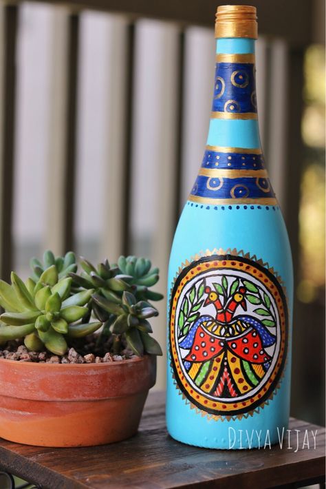 Repurpose used bottles giving then an eccentric makeover. Madhubani/Mithila painting on bottle. #divyavijaystudio #chezfnu #madhubanipainting Madhubani Pot Painting, Rickshaw Art, Bottle Art Projects, Mithila Painting, Painted Glass Bottles, Garden Diy Ideas, Madhubani Paintings, Hand Painted Wine Bottles, Pot Decoration