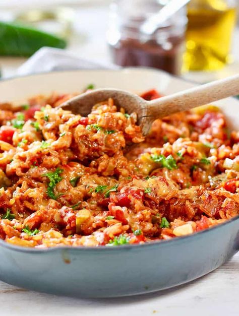 This our Best Spanish Rice recipe! We make it again and again. It's a one pot wonder of a side dish. Simple ingredients combined to make a ton of flavor! #spanishrice #easyrice #ricedish Spanish Rice Recipe With Ground Beef And Bacon, Spanish Rice Recipe With Bacon, Spanish Rice With Bacon, Spanish Rice Recipe With Ground Beef, Best Spanish Rice, Best Spanish Rice Recipe, Mexican Rice Dishes, One Pot Wonder, Spanish Rice Recipe