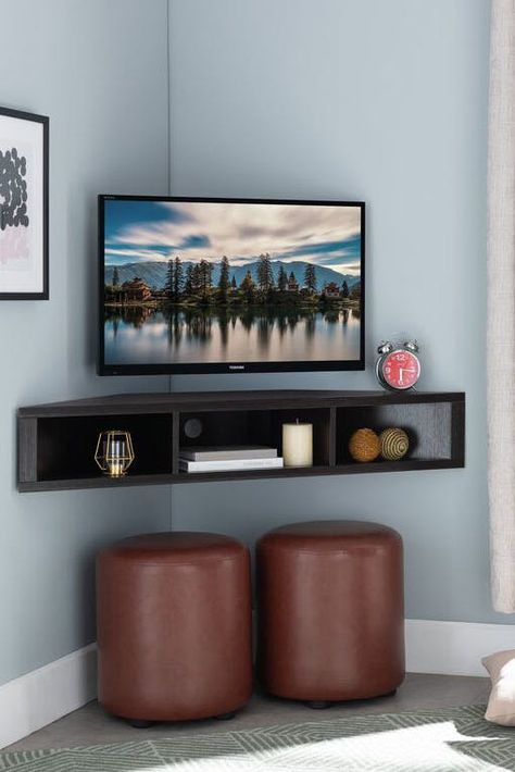 20 Floating Shelves Ideas, So You Can Create Extra Storage Space That Isn’t an Eyesore #purewow #organizing #home #decor #home picks Floating Corner Tv Stand, Corner Tv Ideas, Corner Tv Console, Wall Mounted Media Console, Corner Tv Stands, Ruang Tv, Corner Tv Unit, Furnitur Ruang Keluarga, Small Condo