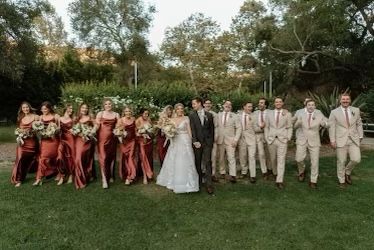 Wedding Party Photos Terracotta, Copper And Tan Wedding Party, Men’s Wedding Party Suits, Terracotta Themed Wedding, Rustic Wedding Terracotta, Boho Fall Wedding Groomsmen, Rust Wedding Party Bridesmaid Dress, Terracotta And Green Wedding Theme, Terracotta Bridesmaid Dress With Groomsmen