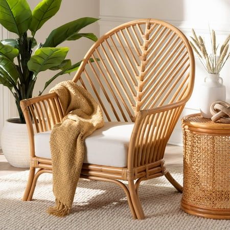 Take hold of tranquil leisure in your space with the lovely Lisabon arm chair. Made in Indonesia, this bohemian piece is beautifully handcrafted from natural rattan by skilled artisans. The smooth curves of its round backrest flow around the frame to form flared armrests. The Lisabon will arrive fully assembled and is fitted with a removable seat cushion. Exhibiting a stunning chevron design, the Lisabon arm chair bequeaths a quality of ease. Disclaimer: Rattan is a product of nature and may have variations in areas such as, but not limited to, color, pattern, grain and texture. The hair-like strands of rattan/rattan-fiber are common due to the nature of the material. Overall: 29.10" W x 31.00" D x 37.00" H; Seating: 22.00" W x 22.50" D x 9.00" H; Arms: 21.70" H; Backrest(from seat up w/o Bamboo Chairs, Cane Chairs, Brown Armchair, Boho Chair, Bamboo Chair, Deck Box Storage, Set Ideas, Indoor Chairs, Wicker Chairs