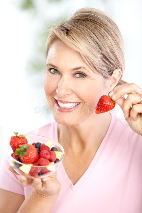 Woman. Mature smiling woman eating strawberries #Sponsored , #Paid, #ad, #Mature, #strawberries, #eating, #Woman Woman Stock Image, Woman Eating, Fruit Diet, Modern Graphic Art, Smiling Woman, Stock Photos Woman, Fruits Images, Strawberries, Graphic Art