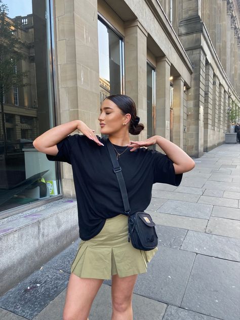 girls streetwear outfit with green mini cargo skirt, Adidas sambas, oversized tshirt, carhartt side bag, minimal scandi style outfit Cargo Skirt Outfit Ideas, Cargo Mini Skirt Outfit, Girly Streetwear Outfits, Girly Streetwear, Cargo Skirt Outfit, Cargo Skirt, Miniskirt Outfits, 1 Girl, Streetwear Outfit