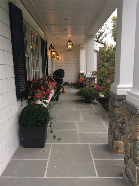 My final remodel of the front porch. New bluestone patio, mums, stone column bases, window boxes with ivy and impatience Front Porch Materials, Black Brick Porch, Front Porch Stone Ideas, Tiled Front Porch Entrance, Bluestone Front Porch, Tiled Porch Floor Entrance, Front Porch Walkway Ideas, Front Porch Floor Ideas, Tile Front Porch Entrance