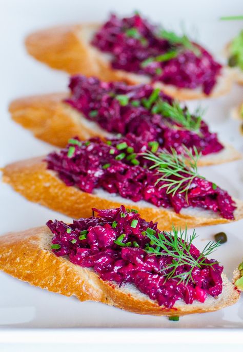 Cooked beets dressed with pressed garlic, mayonnaise and fresh dill. This recipe was originally a salad recipe that my mother made all the time, one of my favorites! I find that the salad recipe works great as a spread, too! The garlic packs a punch but it’s balances by the sweet beets and savory dressing. […] Russian Beet Salad, Cooked Beets, Garlic Mayonnaise, Crostini Recipe, Crostini Recipes, Beet Recipes, On Toast, Cafe Menu, Snacks Für Party