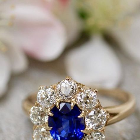 Lang Antique & Estate Jewelry on Instagram: "What do you think- do you see this adorable Ceylon sapphire and diamond ring as an engagement ring (#somethingblue) or as a symbol of self love (#buyyourownbling)? . . . . #weddinginspiration #weddingwednesday #ceylonsapphire #sapphireengagementring #diamondhalo #haloring #vintageengagementring #vintageaesthetic #cherryblossom #appleblossom #clusterring #vintagebride #elopement #langantiques" Engagement Rin, Jewelry Girl, Antiques Jewelry, Sapphire And Diamond Ring, Ceylon Sapphire, Plan My Wedding, Royal Jewels, A Symbol, Vintage Bride