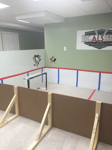 Mini knee hockey rink made by mom using poster board and vinyl plywood. Basement Hockey Room, Hockey Training Room, Hockey Garage, Basement Hockey, Mini Hockey Stick Storage, Indoor Hockey Rink In House, Basement Hockey Rink, Mini Sticks Hockey Room, Mini Stick Hockey Room