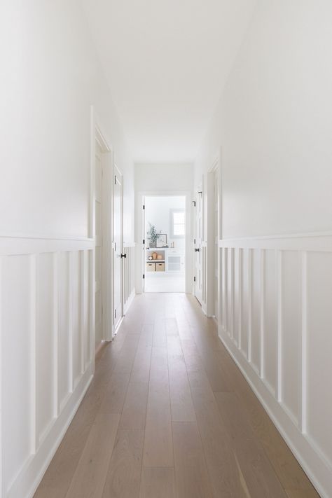 White Wall White Wainscoting, Beach Wainscoting Ideas, White Wainscoting Cream Walls, White Walls With Wainscotting, White Walls With White Wainscoting, White Wall With Molding, Entry With Wainscotting, Modern Wainscoting Hallway, Wall Color With White Wainscotting