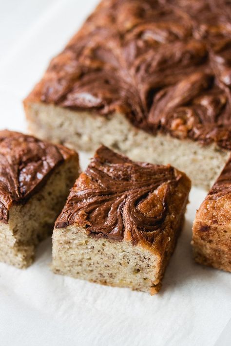 This easy-to-make banana Nutella cake is rich, moist, tender, and swirled with gobs of creamy Nutella. It's absolutely incredible! Nutella Banana Cake, Banana Nutella Cake, Nutella Cake Recipe, Banana And Nutella Cake, Best Nutella Recipes, Nutella Cheesecake Bars, Nutella Recipes Cake, Nutella Banana Bread, Nutella Cake