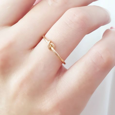 Knot Ring In Solid Gold / 14k / Simple Stacking Gold Ring / Unisex Jewelry / Minimalist Ring / Fine Jewelry / Dainty Ring This ring has a minimal design, and you can wear it any day and combine it with other ring. It makes for an excellent gift for a loved one, without being extravagant. Since the ring is made of pure gold you don't have to remove it when you are washing your hands, washing the dishes etc. * Made to Order * Gold KT: 9K, 14K and 18K Solid Gold * Choice of Gold Color: Rose Gold, Y Infinity Knot Ring, Gold Knot Ring, Infinity Knot, Tiny Rings, Gold Ring Designs, Jewelry Minimalist, Jewelry Dainty, Solid Gold Ring, Etsy Gold Ring