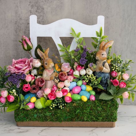 Ostergesteck easter decoration Farmhouse Easter centerpiece Easter bunny decor Kitchen centerpiece ITEM DETAILS: * Materials: Artificial flowers, wooden stand, plastic hare figurines, foam plastic eggs.     Height - 11.8 In (30 cm)     Width - 4.49 (11.4 cm)     Length - 10, 86 (27.6 cm) 💐You can look at the FAQs: * Care instructions flower arrangement * Returns and exchange details * Can I change flowers and or colors in the bouquets? * Shipping * Storage 💐Important! -Real colors may slightly Easter Bunny Centerpiece, Easter Bunny Figurines, Easter Bunny Decor, Kitchen Centerpiece, Easter Designs, Farmhouse Easter Decor, Bouquet Box, Spring Table Decor, Farmhouse Easter