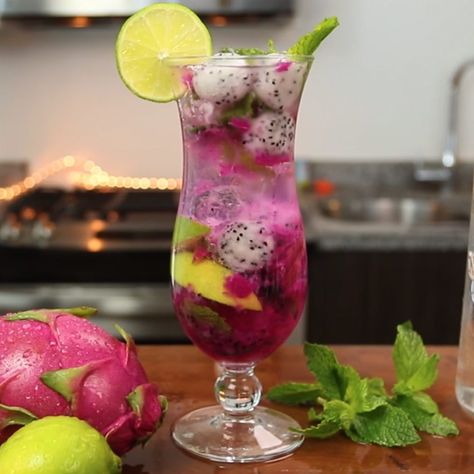 The Dragon Fruit Mojito is one of the tastiest variations on the classic Mojito recipe we've ever tried. This beautiful, fruity mixed drink combines coconut rum, simple syrup, lemon-lime soda, dragonfruit, lime wedges, and mint leaves, and tastes like a refreshing burst of relaxing island life. Fruit Mojito, Cake Watermelon, Fruit Cocktail Cake, Mojito Recipe Classic, Fruity Mixed Drinks, Easy Mixed Drinks, Classic Mojito, Cocktail Cake, Cocktail Summer