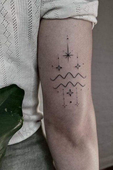 Looking for Aquarius tattoo ideas?! These Aquarius tattoos are STUNNING, whether you want small or large, cute and dainty, we've for the perfect Aquarius tattoo designs here Aquarius Tattoo Spine, Aquarius Minimalist Tattoo Women, Aries Aquarius Tattoo, Aquarius Waves Tattoo, Tattoo Ideas Female Aquarius, Aquarius Hand Tattoo, Aquarius Tattoo Ideas Unique, Aquarius Tattoos For Women, Aquarius Zodiac Tattoo