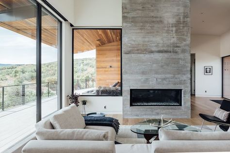 An Interior Designer’s Utah Abode Blends Mountain Living With Scandinavian Style #dwell #utah #scandinaviandesign #modernfireplaces #modernlivingrooms Druid Garden, Maisonette Ideas, Ribbon Fireplace, Scandinavian Fireplace, Formed Concrete, Featured Wall, Fireplaces Layout, Board Formed Concrete, Extension Plans