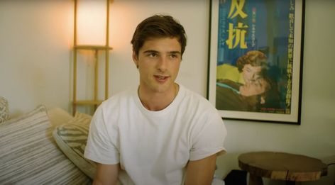 His couch is decorated with neutral striped pillows, and a wooden stool is pushed up against the wall. Jacob Elordi House, Jacob Elordi Euphoria, Jacob Elordi Height, Jacob Elordi Shirt Off, Jacob Elordi Camera, Jacob Elordi As A Kid, Jacob Elordi Man About Town, Striped Pillows, Los Angeles House