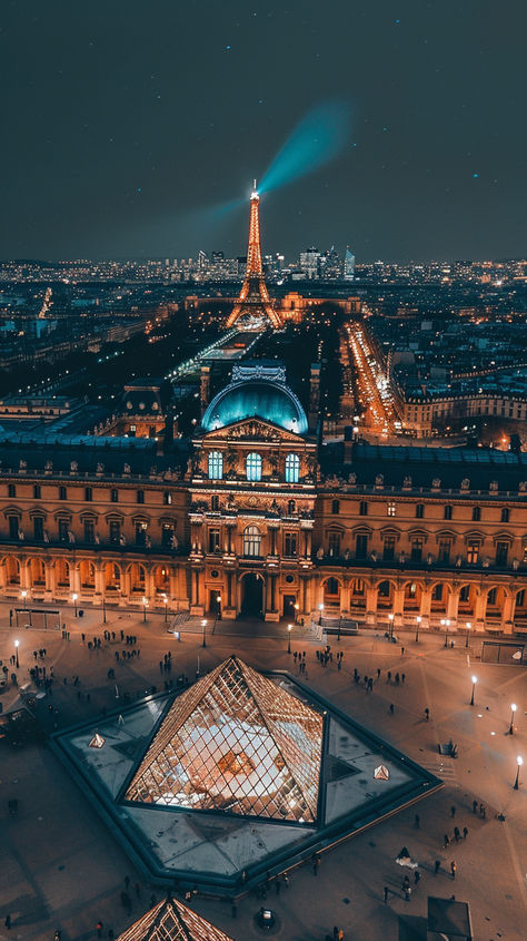 A breathtaking night view of Paris, with the iconic Louvre Museum and its illuminated glass pyramid at the center. The Eiffel Tower glows in the background, while people stroll through the open square that connects historic charm and modern design.🌟🏛️✨ #ParisNights #LouvreMuseum #EiffelTowerView #ParisCityscape #NightViews #HistoricAndModern #LouvrePyramid #CityOfLights #ParisArchitecture #TravelGoals #IconicLandmarks #RomanticParis Paris Louvre Museum, Paris Monuments, Glass Pyramid, Louvre Pyramid, Paris Architecture, Romantic Paris, Classic House Design, Louvre Paris, Louvre Museum