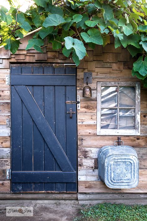 Learn how building a barn door for a rustic shed with reclaimed wood and rusty junk hardware really woke this little rustic garden shed up! Includes how to side a shed with reclaimed wood. Click to full tutorial with many more how-to pictures! Shed Redo Exterior, Rusty Junk, Reclaimed Wood Siding, Rustic Shed, Small Garden Shed, Building A Door, Building A Barn Door, Build A Shed, Upcycled Projects