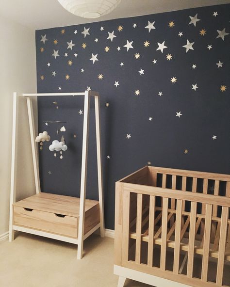 My little boy’s starry night themed nursery scandiborn clouds mobile mamas and papas furniture hand painted with stencils with silver gold and white paints from Homebase Nighttime Nursery Theme, Nursery Space Theme, Starry Night Nursery Gender Neutral, Starry Night Nursery, Starry Nursery, Starry Night Bedroom, Star Mural Nursery, Starry Night Nursery Bedding, Clouds Mobile