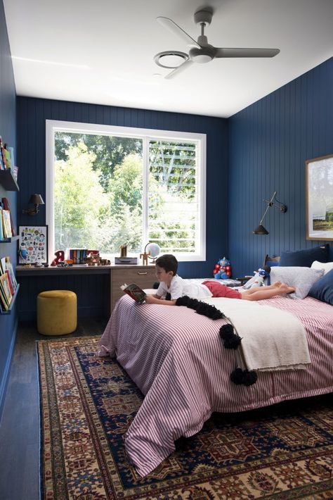 House call: Carlene and Michael’s resort-style family home. Blue boys bedroom with VJ wall panels, funky wall lamp next to bed, sophisticated boys room Quirky Bedroom, Blue Boys Bedroom, Primary Colours, Deco Studio, Quirky Home Decor, Blue Boy, Room Walls, Window Shutters, غرفة ملابس