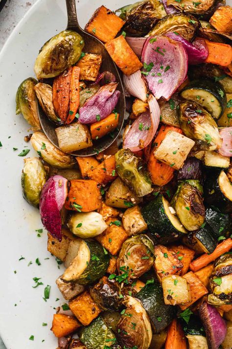 Meet your new favorite side dish: our Easy Oven Roasted Vegetables. These versatile veggies, including sweet potatoes, red onion, zucchini, and carrots, are drizzled in balsamic, seasoned, and oven-roasted to perfection. Great for meal prep - just make a big batch and enjoy throughout the week! Roasted Vegetables Seasoning, Roasted Zucchini Recipes, Carrots In Oven, Sweet Potato Oven, Roasted Fall Vegetables, Easy Roasted Vegetables, Oven Roasted Sweet Potatoes, Roasted Potatoes And Carrots, Red Potato Recipes