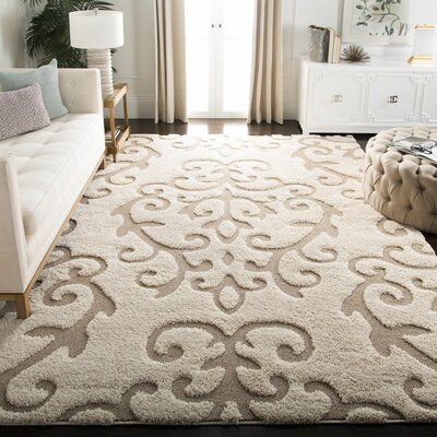 This shag captures the laid-back lifestyle of the southern peninsula in an ultra-soft, crème tone-on-tone floor covering. A sculpted high-low pile accentuates the detailed damask vine designs for the rich textural dimension. Constructed using power-loomed synthetic yarns for a durable, casual shag carpet that will retain vivid color and striking texture for years to come. Rug Size: Rectangle 9'6" x 13' | Brown / White Area Rug - Astoria Grand Blaris Damask Cream / Beige Area Rug Polypropylene in Damask Rug, Cozy Homes, Shag Carpet, Rug Size Guide, Beige Area Rug, White Room, Shag Area Rug, Floor Covering, Scroll Design