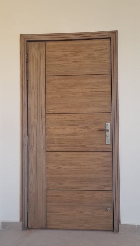 Elegant, sturdy door that adds charm and withstands daily use Flush Door Design, House Window Design, Modern Tv Wall Units, Pivot Door, Wooden Front Door Design, Wooden Main Door, Modern Tv Wall, Wooden Main Door Design, Modern Cupboard Design