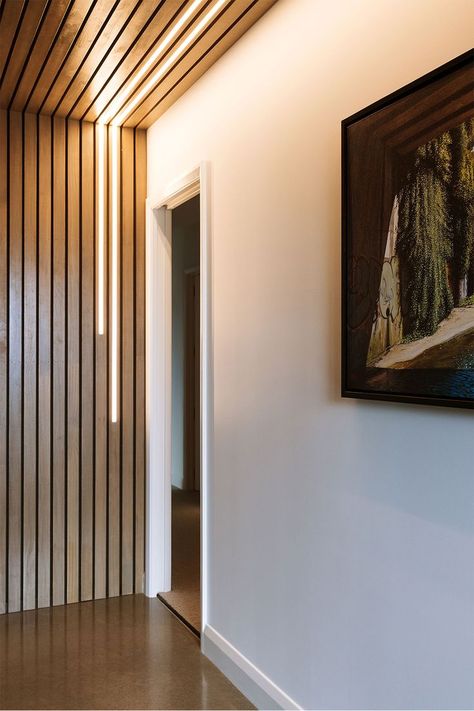 Golden timber battens line the ceiling and far wall of the entryway with hidden LED lighting adding a unique design element. Timber Battens, Design Brief, Timber Walls, Business Manager, Steel Shelving, Three Bedroom House, Double Shower, Construction Business, Construction Industry