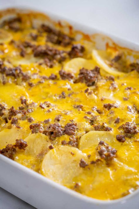 Cheesy Hamburger Potato Casserole | 12 Tomatoes Cheesey Potatoe Hamburger Casserole, Cheesy Hamburger Potato Casserole, Beef And Potato Casserole Recipes, Hamburger Potato Cheese Casserole, Hamburger And Potato Casserole Recipes, Potato Hamburger Casserole, Potato And Hamburger Casserole, Potato And Beef Casserole, Cheesy Hamburger Casserole