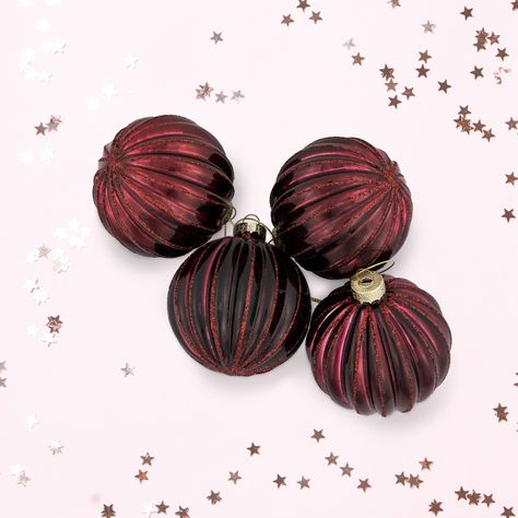 Crafted with meticulous attention to detail, these ornaments boast a stunning maroon hue that shines and sparkles when caught by the twinkle of holiday lights. The lined ribbed texture, adds dimension and visual appeal to your holiday trees. Adorn your wreaths and garlands to instantly elevate your festive ambiance, or add to a centerpiece. Pair with our maroon glass onion holiday ornament set for a complete look. Product Features: Set of 4 holiday glass ball ornaments Maroon ornaments with a ri Maroon Christmas Tree, Glass Ball Christmas Ornaments, Moody Christmas, Glass Onion, Holiday Trees, Christmas Themes Decorations, Glass Ball Ornaments, Wreaths And Garlands, Silver Ornaments