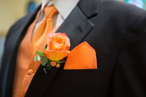 Groomsmen tuxes with orange Black Suit Orange Tie Groomsmen, Black And Orange Tuxedo, Orange And White Wedding Dress, Black Suit Orange Tie, Orange And Black Wedding, Black And Orange Wedding, Larry Wedding, Fall Groomsmen, White Jeans For Men