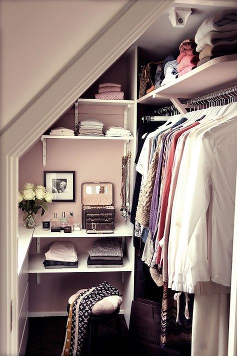 Sweet pink closet design with pink walls and sloped ceiling. Gorgeous walk-in closet design with built-in shelves and built-in vanity filled with faux python jewelry box and collection of perfumes. Small Walk In Closet, Attic Closet, Walking Closet, Walk In Closet Design, Real Estat, Attic Renovation, Attic Storage, Attic Remodel, Dream Closets