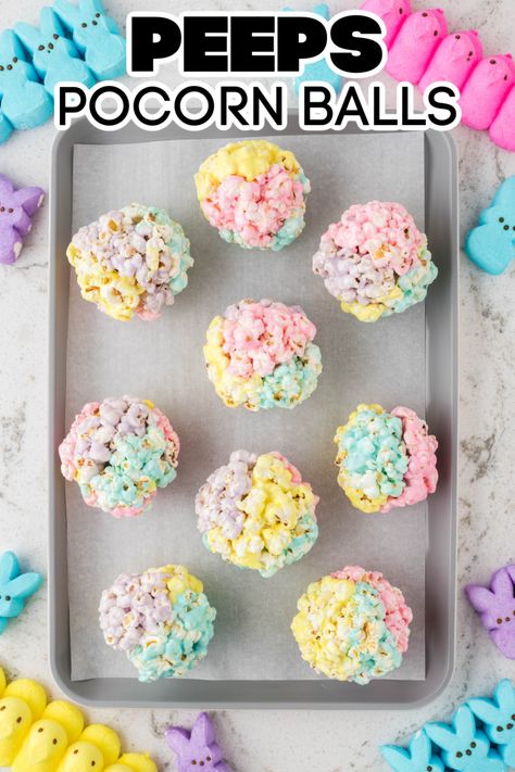 Colorful popcorn balls on a baking dish. Peeps Marshmallow Treats, Easter Popcorn Balls, Easter Popcorn Treats, Peep Rice Crispy Treats, Peeps Popcorn, Rice Crispy Treats With Peeps Recipe, Corn Bar, Colorful Popcorn, Nesting Party