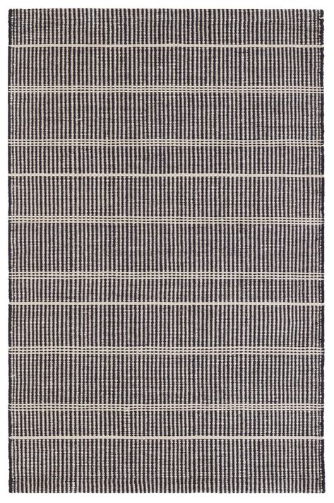 PRICES MAY VARY. SAMSON DESIGN: Part of our Bunny Williams collection, this delicately striped, black indoor/outdoor rug was inspired by an antique rug sample from the designer's own personal collection. FEATURES & BENEFITS: Eco-friendly polyester fiber made from recycled plastic bottles; durable construction, UV-treated for fade resistance; soft, wool-like texture; lightweight; often reversible; washable, scrubbable. WHERE TO USE: Just right for high-traffic areas and the porch or patio. BROUGH Bunny Williams, Dash And Albert Rugs, Annie Selke, Dash And Albert, Dhurrie Rugs, Indoor Outdoor Rug, Black Area Rugs, Neutral Rugs, Indoor Outdoor Area Rugs