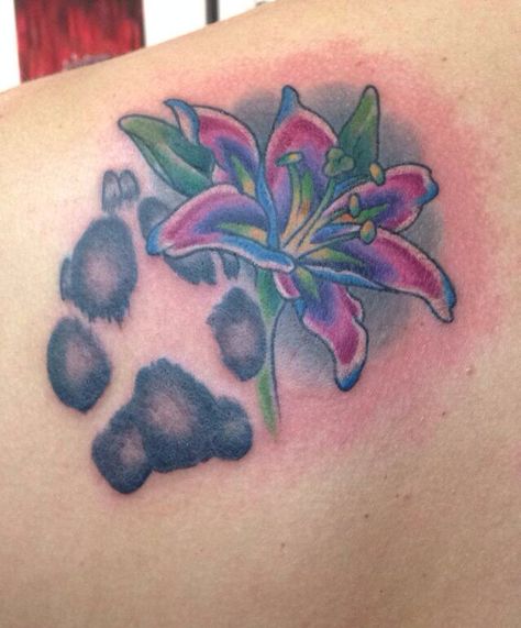 This paw print looks awesome! It's hard to find someone who can tatt a realistic paw/hand/or footprint Flower Tattoo With Paw Print, Paw Print Tattoo Back Of Leg, Lily Tattoo With Paw Print, Flower Tattoos With Paw Prints, Dog Paw Print Tattoo On Thigh, Symbol For Family Tattoo, Paw Hand, Mother Son Tattoos, Daffodil Tattoo