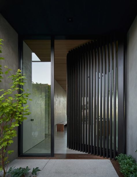 The front facade is covered in cedar screening, including the entryway. Skjulte Rum, Terrace Building, Clad Home, Winery Tasting Room, Seattle Homes, Midcentury Home, Entrance Doors, Victorian Homes, Door Design