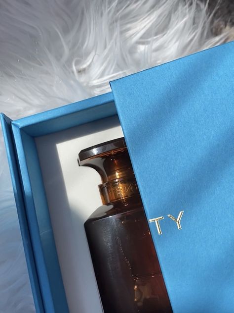 There is a blue box on a fur carpet with an amber perfume bottle inside Fenty Perfume Aesthetic, Fenty Perfume, Apartment Goals, Celebrity Perfume, Luxury Aesthetic, Will Turner, Womens Fragrances, First Impressions, Perfume Collection