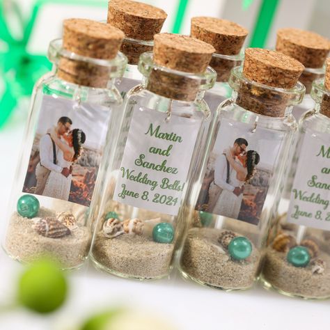 Make your special day unforgettable with these unique wedding favors for guests! Our We Did It On The Beach theme is perfect for beach weddings. These personalized photo mementos serve as a one-of-a-kind thank you gift that your guests will treasure forever. Looking for a memorable way to save the date for your wedding guests? Our We Did It On The Beach themed favors are sure to make a statement. These unique and personalized photo mementos are a perfect way to show your appreciation. Say thank you to your guests with these personalized photo mementos that double as unique save the date gifts for your wedding. Our We Did It On The Beach favors are the perfect way to add a personal touch to your special day. Add a personal touch to your event with our unique message in a bottle keepsakes. H Sand Keepsake, Unique Wedding Favors For Guests, Beach Theme Wedding Reception, Beach Favors, Date Gifts, Destination Wedding Favors, Unique Save The Dates, Wedding Sand, Wedding Giveaways