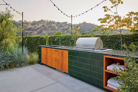 This Tricked-Out, Tiled Outdoor Kitchen Is Better Than Most Indoor Ones Tiled Outdoor Kitchen, Outdoor Kitchen Tile, Modern Surf Shack, Brownstone Boys, Outdoor Kitchen Cabinet, Kitchen Tile Ideas, Heath Tile, Bamboo Roof, Deck Remodel