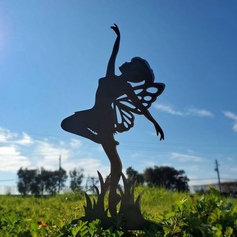 "This sweet little dancing fairy yard art adds adorable charm to a garden edge or potted plant  and is the perfect addition to your garden or patio. Add some magic to your outdoor garden with this beautiful little fairy.  Proudly 100% Made in America by Windy Willows. Unique Fairy garden art made to last through generations.   💙 Dancing Fairy Ballerina  is approximately 9\" x 5\". Spike is approximately 2.25\"   The metal on this fairy yard art is left raw to give this item a one of a kind, uni Fairy Yard, Dancing Fairy, Garden Edge, Fairy Garden Art, Fairy Ballerina, Tree Fairy, Baby Activity Center, Running Jokes, Fairy Gifts