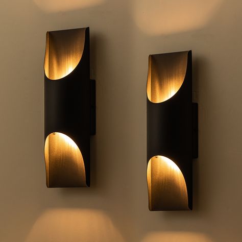 Unique and modern from the inside out, this outdoor wall light will illuminate your outdoor living space with a truly contemporary approach. The wall sconce is a generally rectangular fixture, made of metal in powder-coated black to withstand harsh weather conditions. A curved panel on the front hides integrated LEDs and directs the light they produce up and down, highlighting both the wall light’s own interior surface as well as the texture of the surrounding wall. The gentle ambiance the outdoor light created is ideal near an entry or along a porch. C Cattleya 2-Pack 13.5-in H Matte Black Integrated LED Outdoor Wall Light | LCA2422-2W Craftsman Bungalow Exterior, Wall Sconces Living Room, Up Down Wall Light, Sconces Living Room, Exterior Wall Light, Wall Lighting Design, Concrete Crafts, Outdoor Sconces, Modern Wall Lights